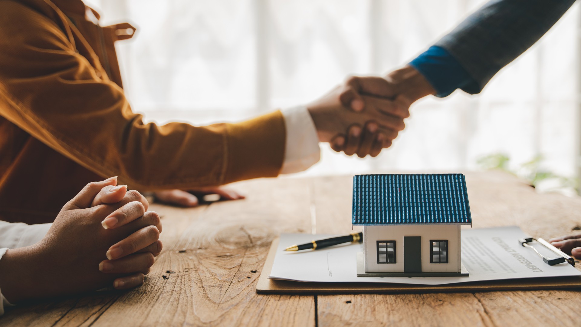 Handshake across the real estate closing table